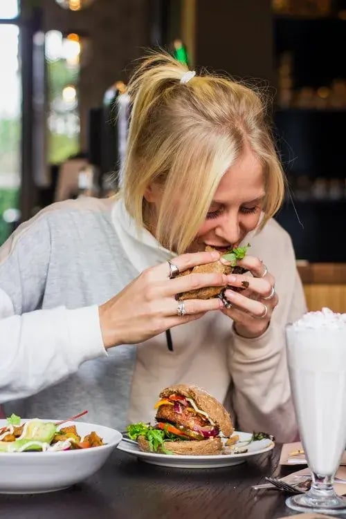 woman eating a burger