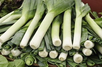Raw leeks on display at farmers market