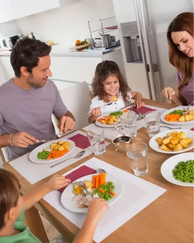 Family eating healthy dinner in kitchen-1